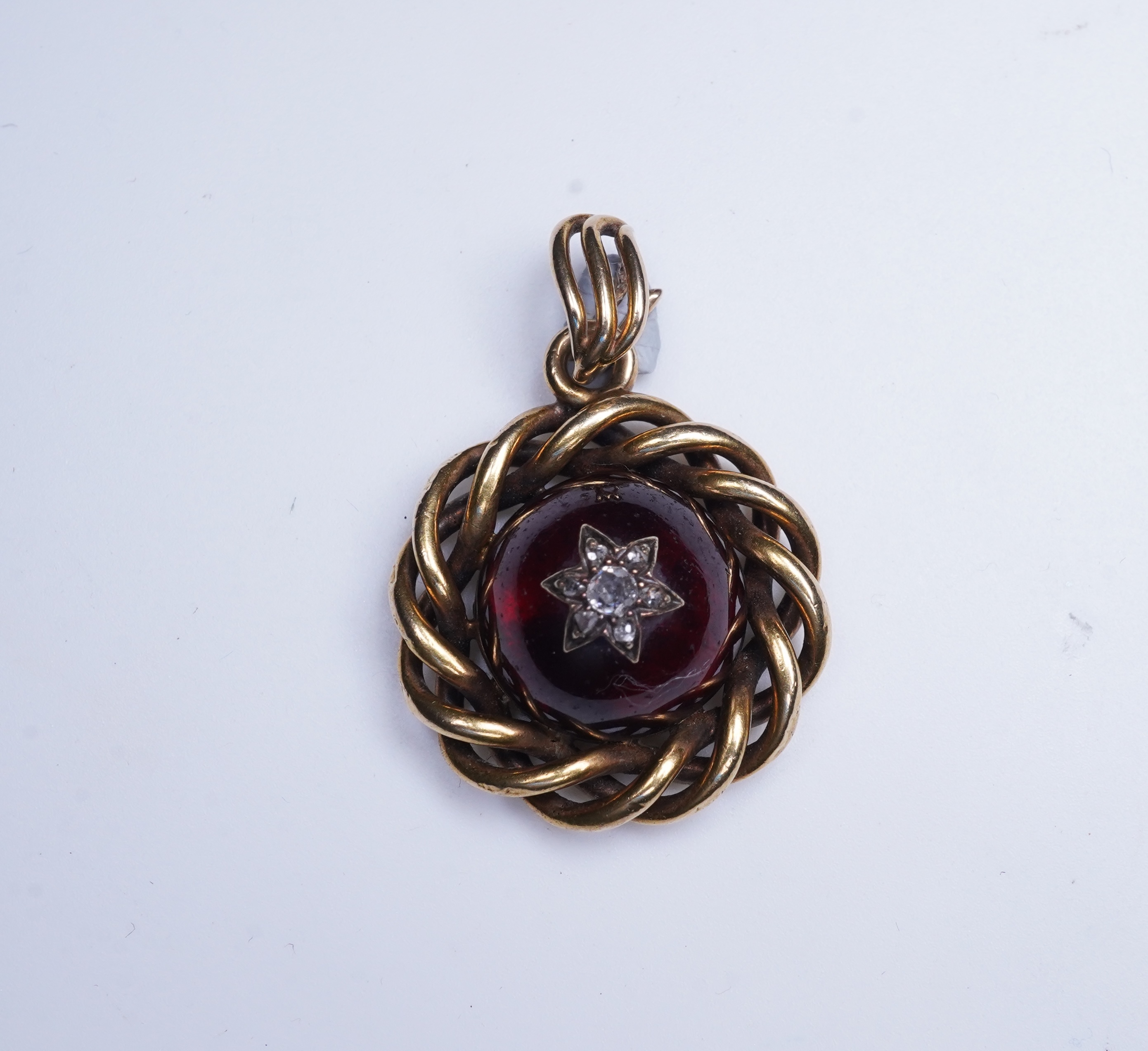 A Victorian garnet and diamond pendant, mid 19th century